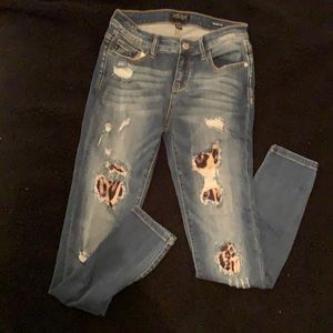 Women’s gently used jeans with cheetah underlay. Super cute!